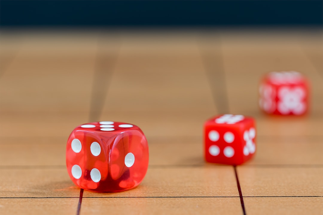 Dice on wooden table | Featured image for the Best Board Games of 2020 blog.
