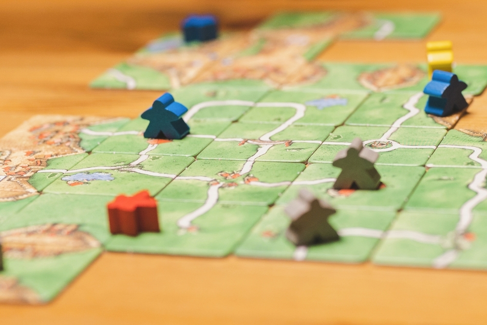 board game late in the evening game cards and chips on table | Featured Image of the Spiel des Jahres Winners 2017 blog page