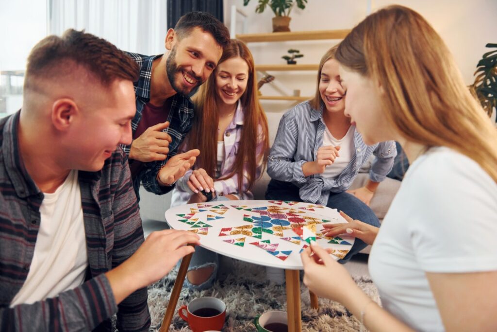 young adults playing board games | Featured image of the Why Board Games Are Making a Comeback in the Digital Age blog
