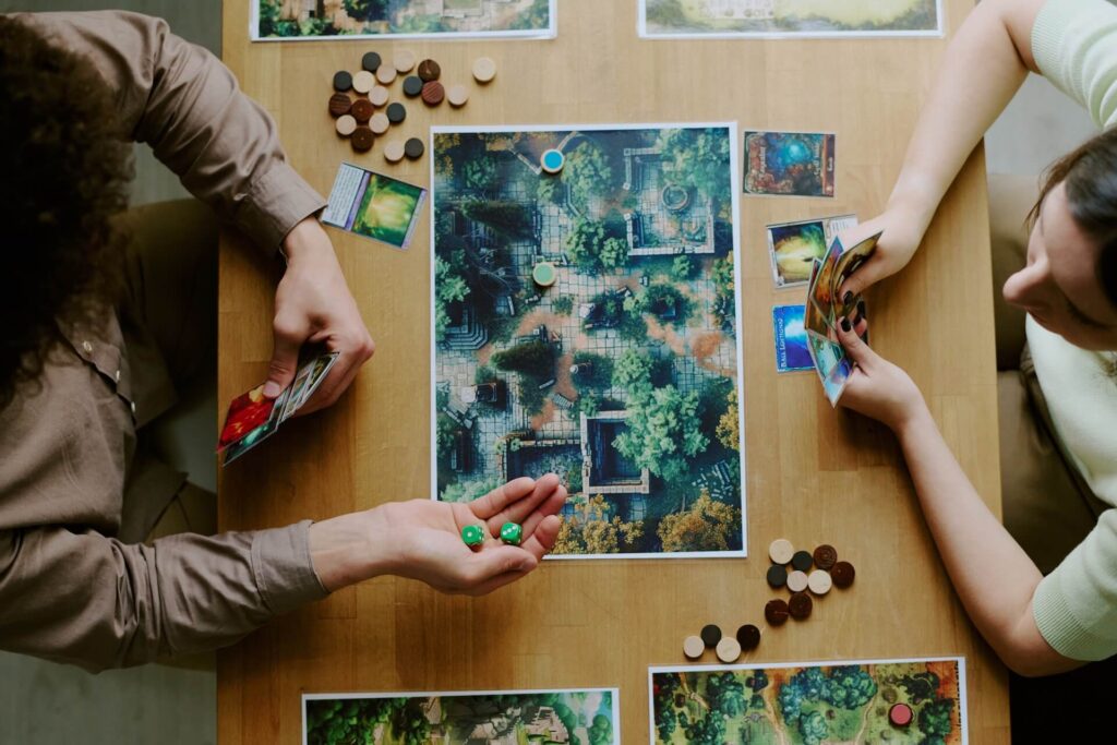 Couple playing a board game | Featured Image for the Where to Start if You're New to Board Games blog.